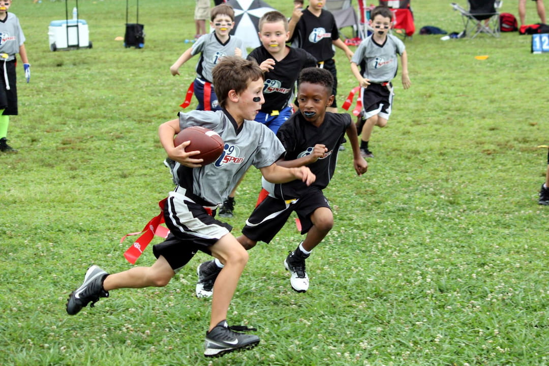 a group of boys playing football