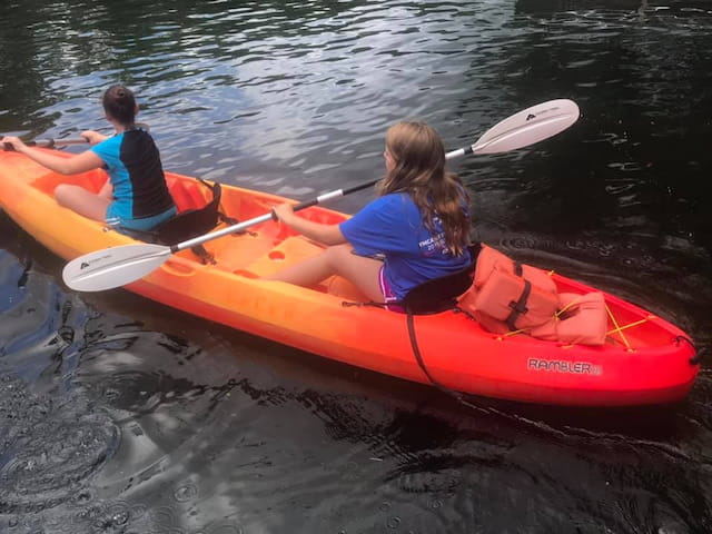 a group of people in a canoe