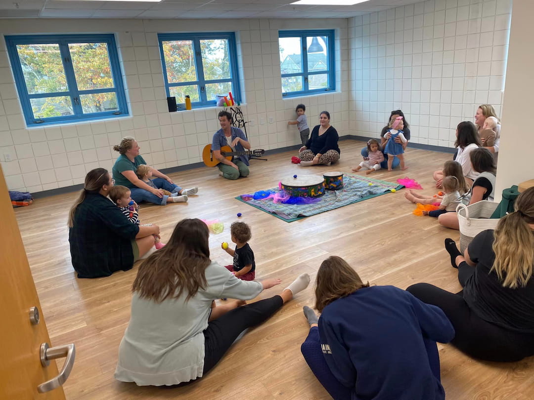 a group of people sitting on the floor