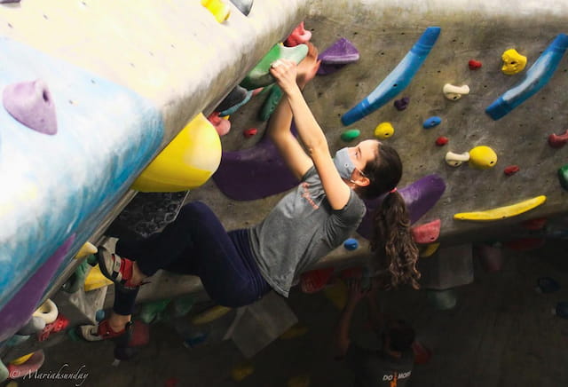 a person climbing a rock wall