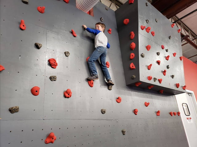a person climbing a rock wall