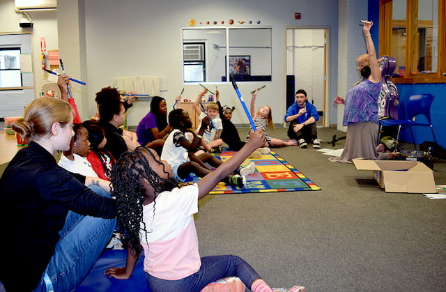 a group of people sitting on the floor