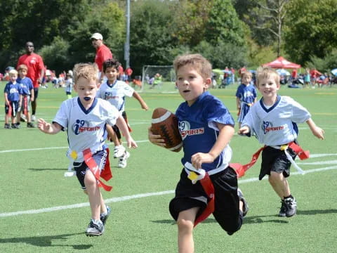 a group of kids playing baseball