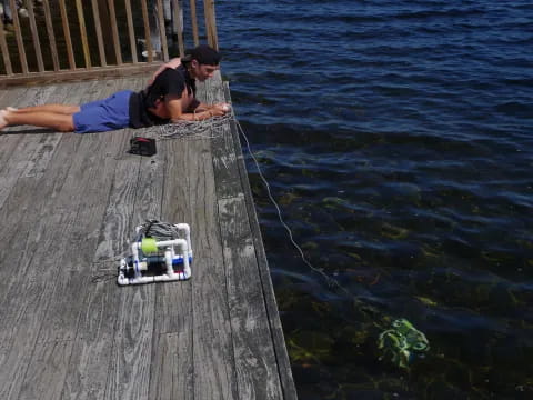 a man lying on a dock