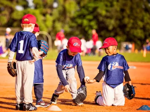 kids playing baseball on a field
