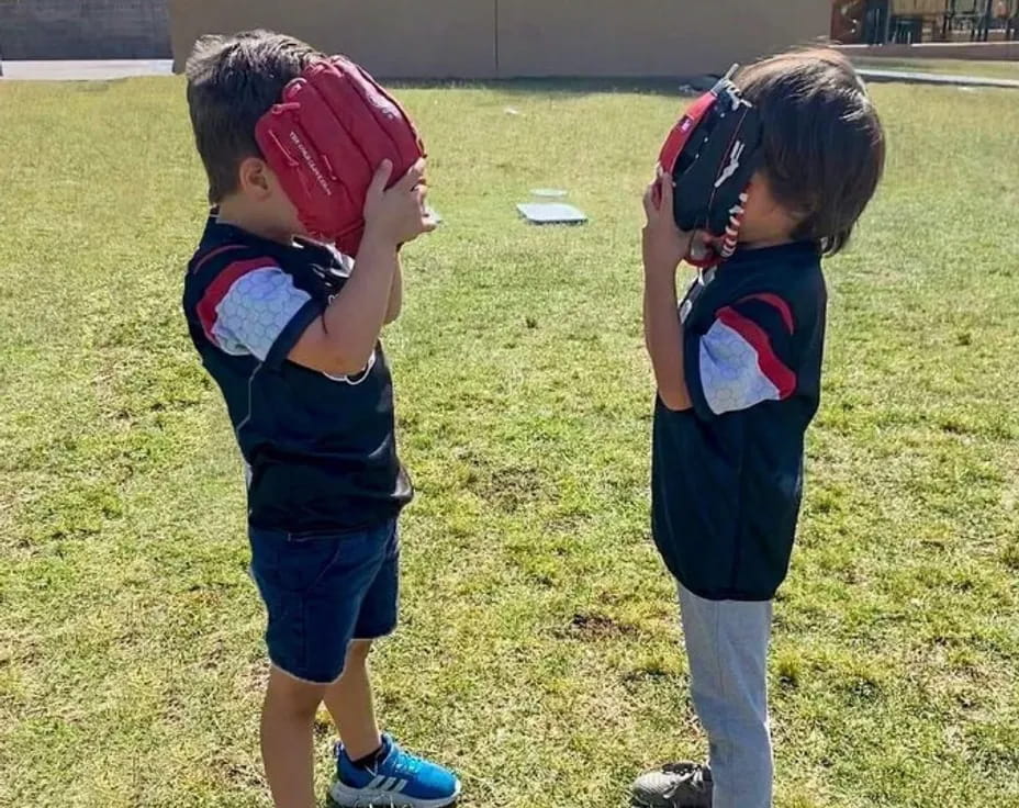 two children wearing helmets