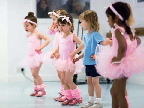 a group of girls in dresses