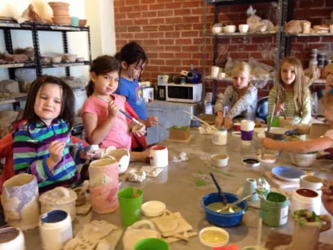 a group of children painting