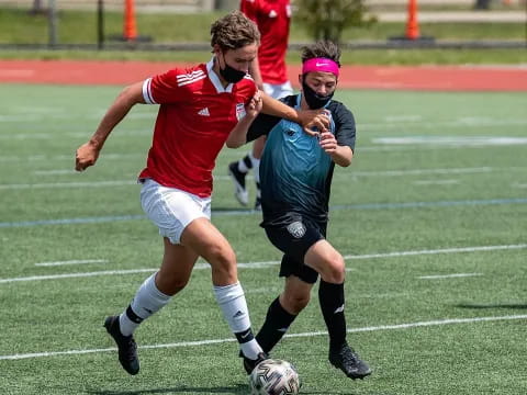 a couple of men playing football