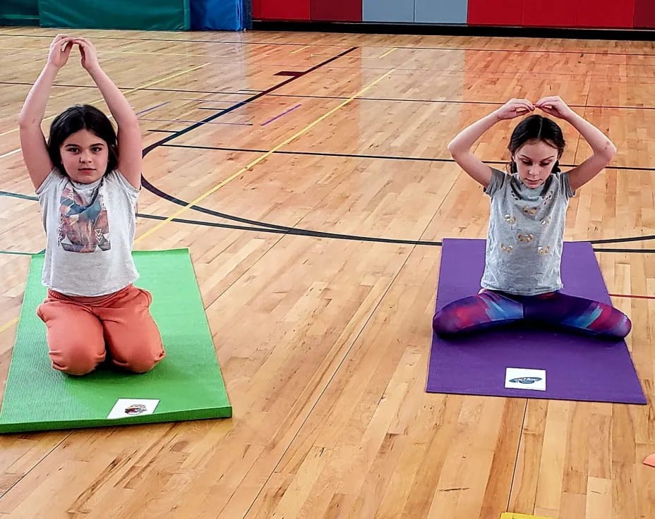 a couple of girls on mats