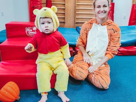 a person and a baby in clothing