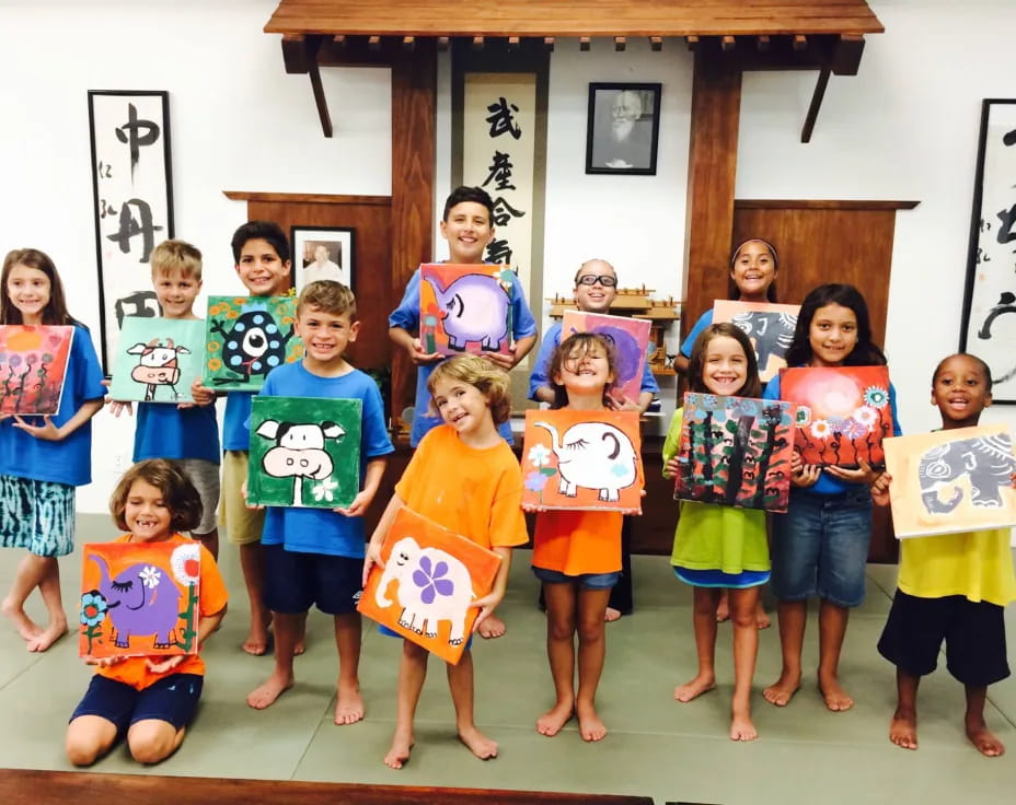 a group of children holding books