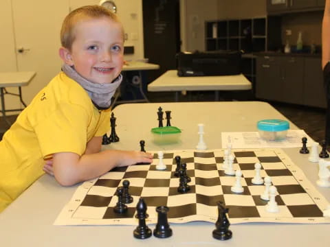 a boy playing chess