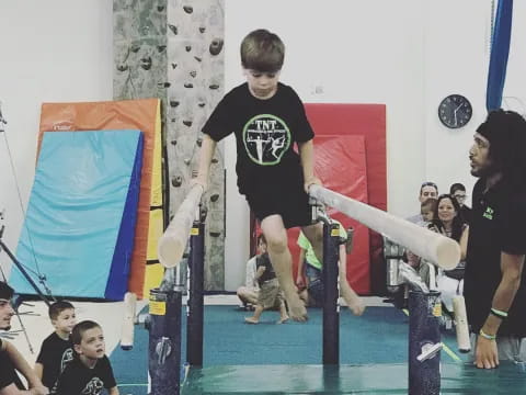 a boy jumping on a pole