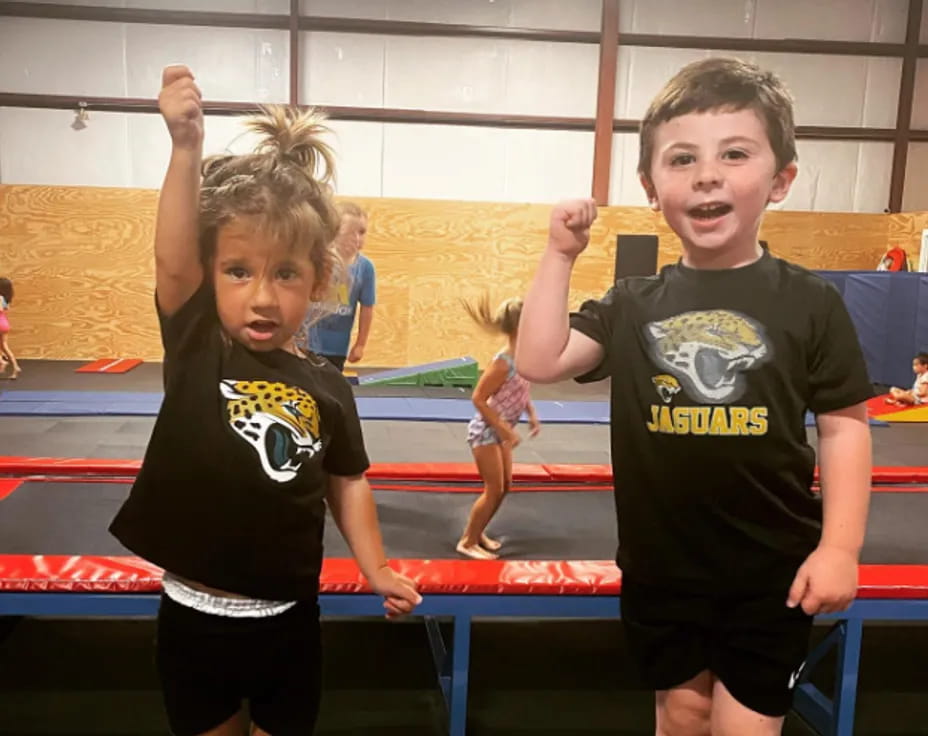 a couple of kids in a gym