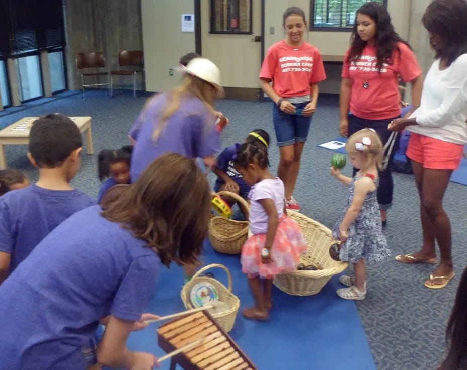 a group of people playing with toys