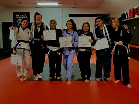 a group of people holding papers