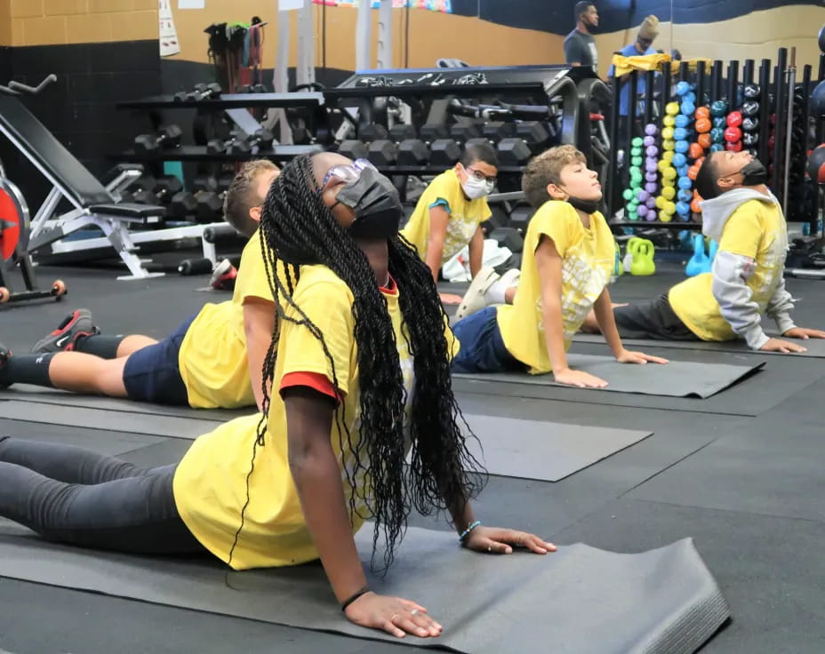 a group of people in a gym