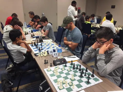 a group of people playing chess