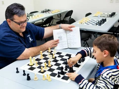a man and a boy playing chess