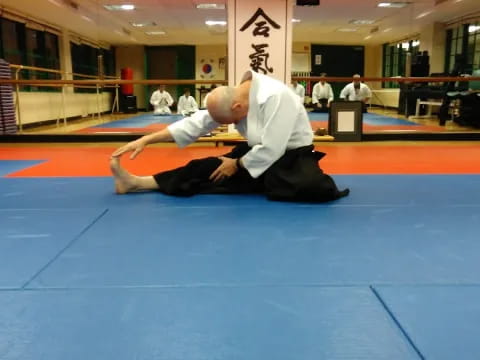 a man doing a push up on a mat
