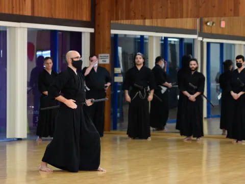 a group of people in black robes