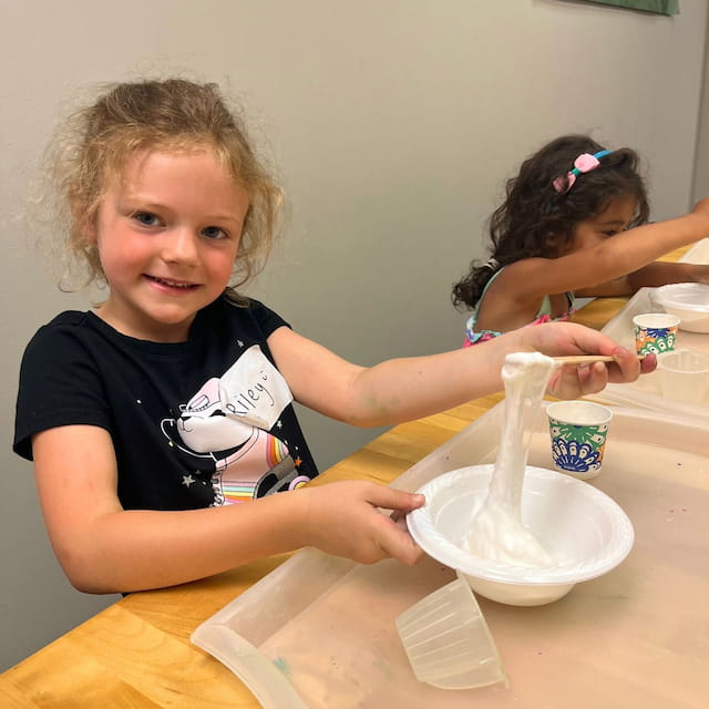 a young girl making a face