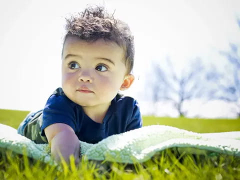 a child lying in the grass