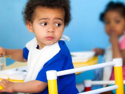 a young boy in a blue shirt