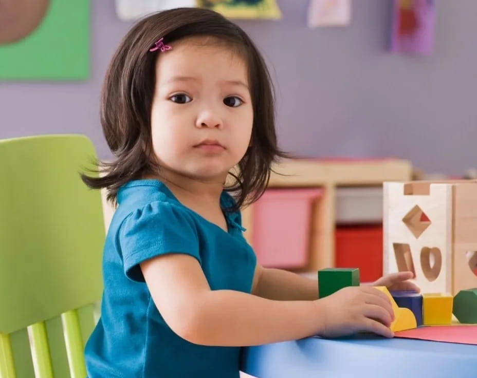 a girl sitting at a desk