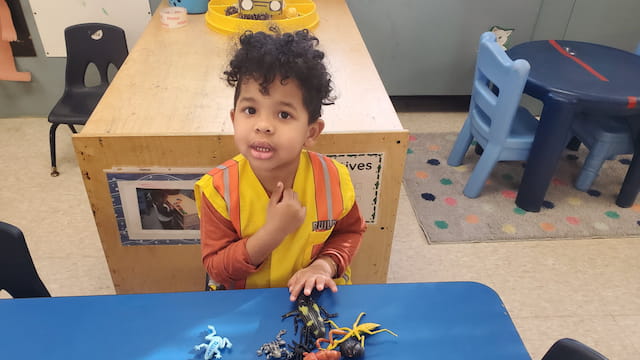 a child sitting at a table