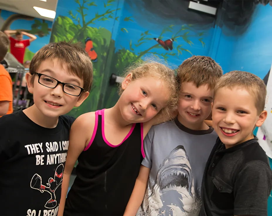 a group of kids posing for a photo