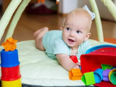 a baby in a toy car