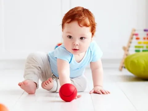 a baby crawling on the floor