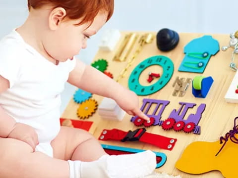 a baby playing with toys