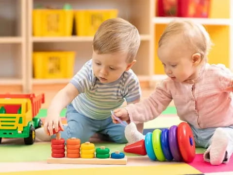 a couple of kids playing with toys
