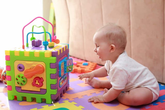 a baby playing with a toy