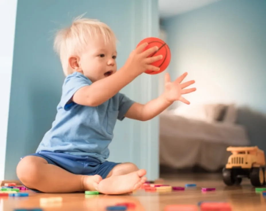 a baby playing with a toy