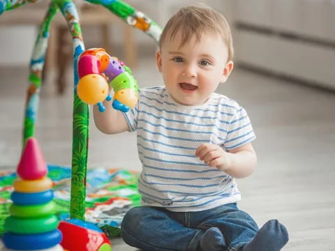 a baby playing with toys