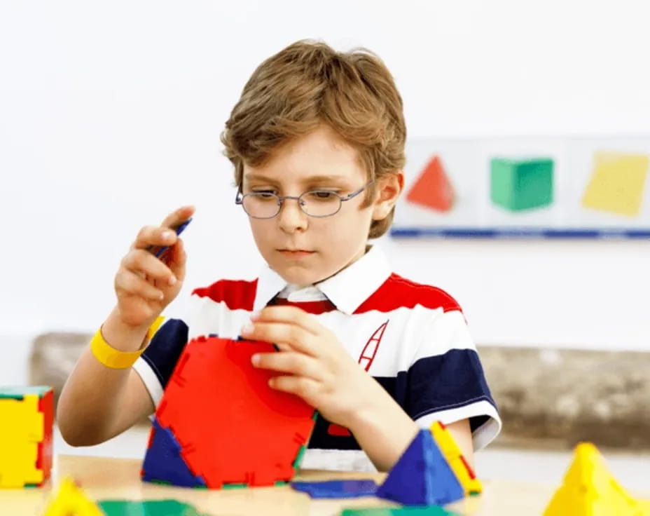 a boy sitting at a table
