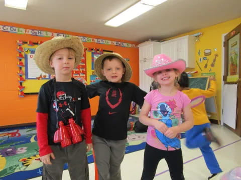 a group of children wearing hats