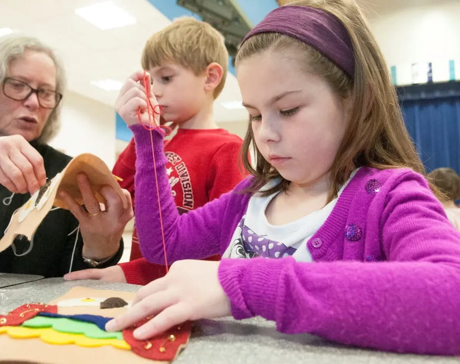 a woman and a child painting