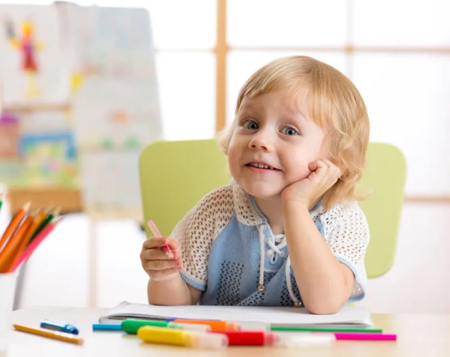 a child sitting at a table