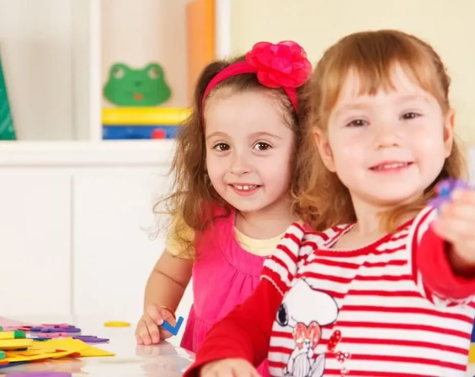 a couple of girls smiling
