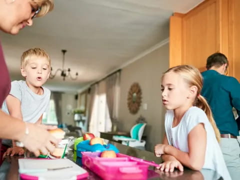 a person and a child in a kitchen