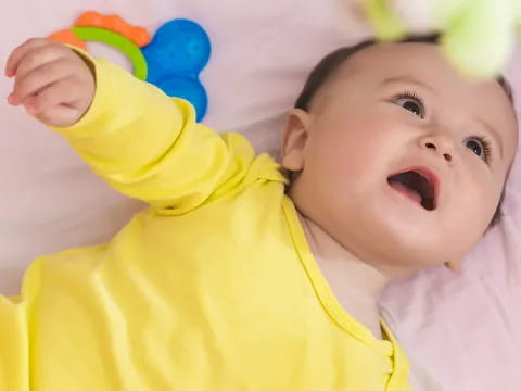 a baby lying on its back
