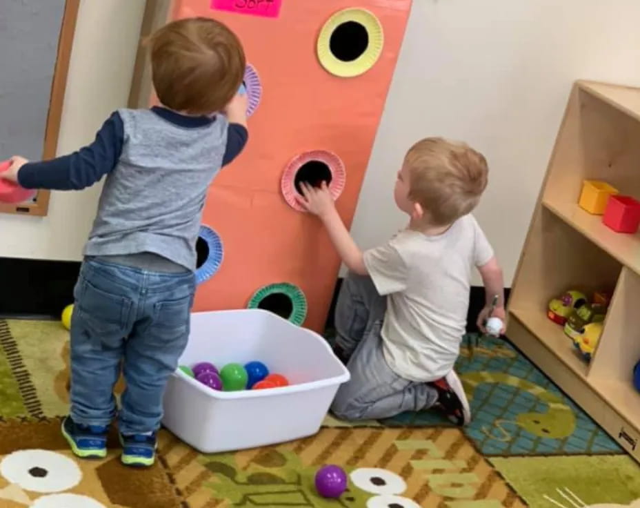 a couple of kids playing with toys