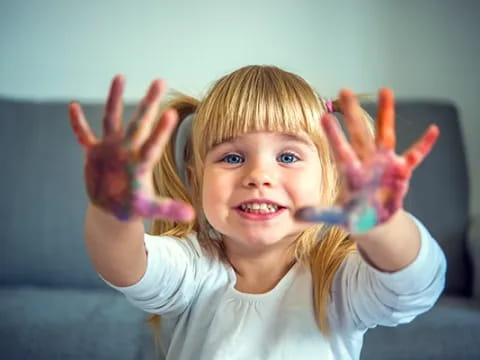 a girl with her hands up