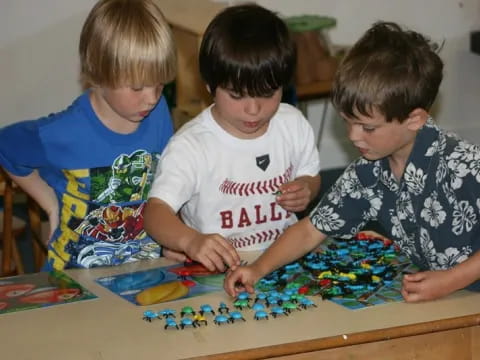 a group of boys playing with toys