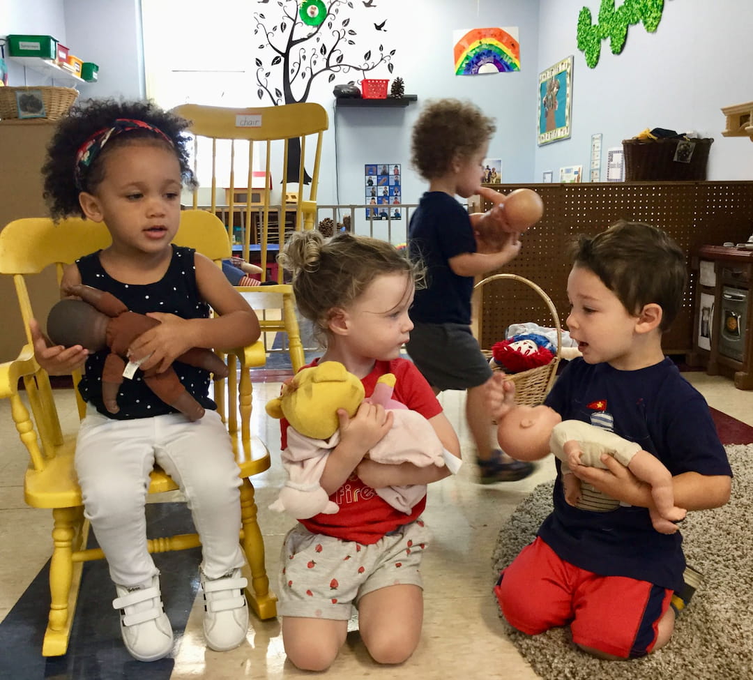 a group of children sitting in chairs